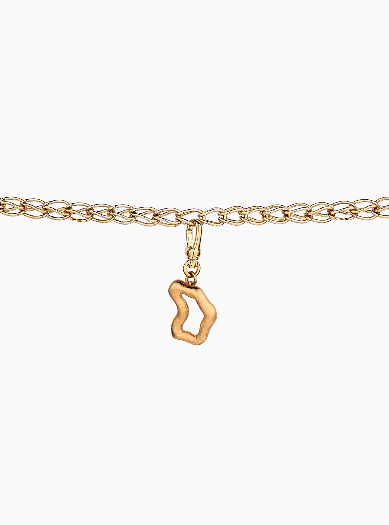 Charm artesanal con forma de mapa Muzo y baño de oro de 24k.